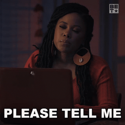 A Woman Is Sitting In Front Of A Laptop With The Words Please Tell Me Below Her GIF