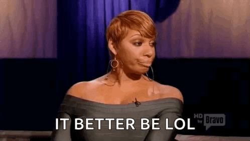 A Woman Is Sitting In Front Of A Microphone And Making A Funny Face . GIF