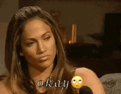A Woman Is Sitting In Front Of A Microphone And Saying Okay GIF