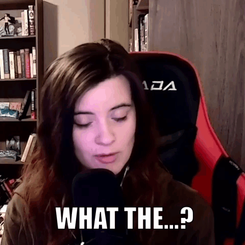 A Woman Is Sitting In Front Of A Microphone And Says What The ... ? GIF