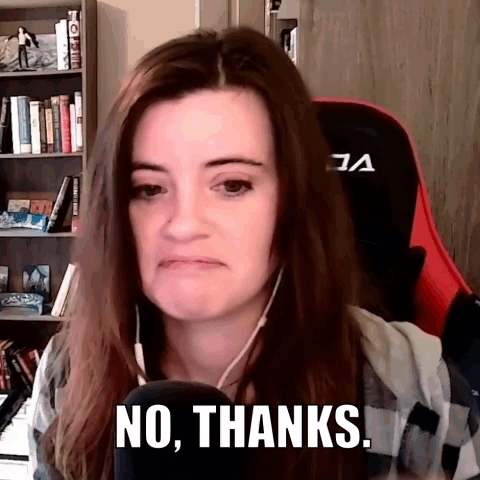 A Woman Is Sitting In Front Of A Microphone Saying No Thanks . GIF