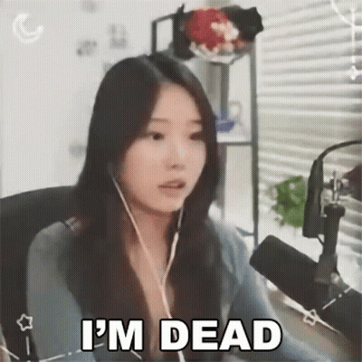 A Woman Is Sitting In Front Of A Microphone While Wearing Headphones And Says `` I 'M Dead '' . GIF