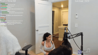 A Woman Is Sitting In Front Of A Microphone With A Sub Goal Of 15/10 GIF