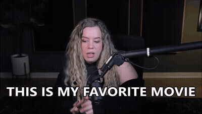 A Woman Is Sitting In Front Of A Microphone With The Words `` This Is My Favorite Movie '' Written Above Her . GIF
