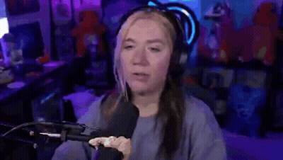 A Woman Is Sitting In Front Of A Microphone With The Words `` What A Save '' . GIF