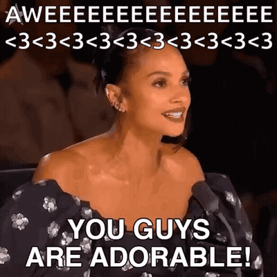 A Woman Is Sitting In Front Of A Microphone With The Words You Guys Are Adorable GIF