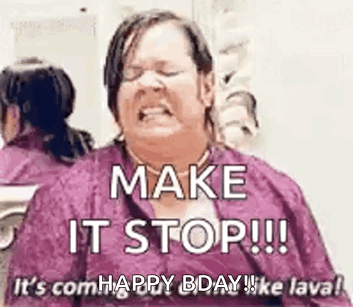 A Woman Is Sitting In Front Of A Mirror With Her Eyes Closed And A Purple Shirt On . GIF