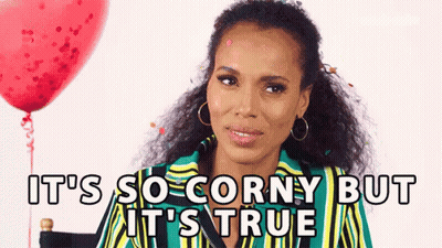 A Woman Is Sitting In Front Of A Red Balloon With The Words `` It 'S So Corny But It 'S True '' GIF