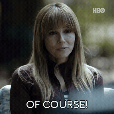 A Woman Is Sitting In Front Of A Screen That Says Of Course GIF
