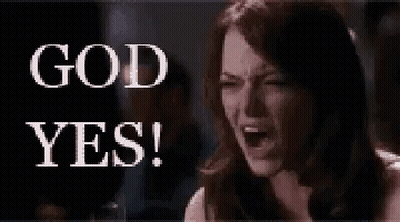 A Woman Is Sitting In Front Of A Sign That Says `` God Yes ! '' GIF