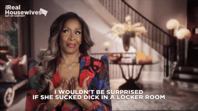 A Woman Is Sitting In Front Of A Sign That Says ' Real Housewives ' On It GIF
