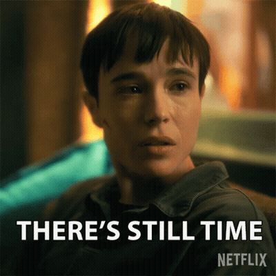 A Woman Is Sitting In Front Of A Sign That Says There 'S Still Time On It GIF