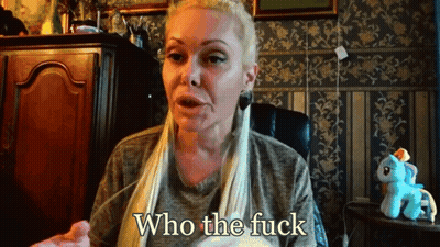 A Woman Is Sitting In Front Of A Stuffed Pony And Says Who The Fuck GIF