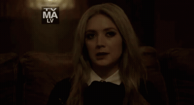 A Woman Is Sitting In Front Of A Tv Ma Lv Logo And The Words Exatamente GIF