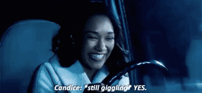 A Woman Is Sitting In The Driver 'S Seat Of A Car . GIF