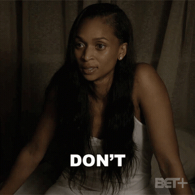 A Woman Is Sitting On A Bed With The Words " To Our Conversation " Behind Her GIF