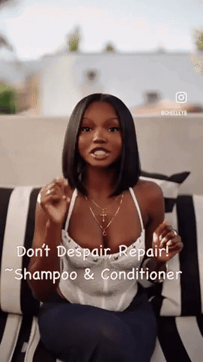 A Woman Is Sitting On A Black And White Striped Couch Talking About Shampoo And Conditioner . GIF