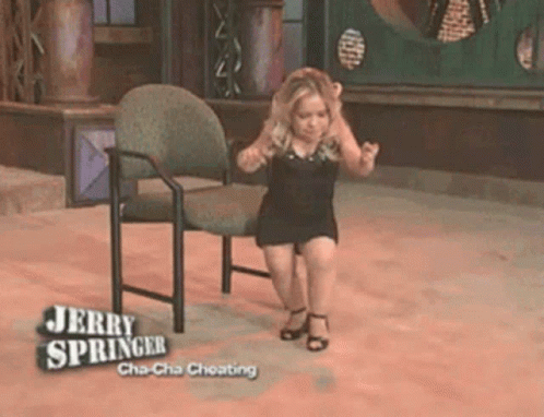 A Woman Is Sitting On A Chair With The Words Jerry Springer Cha-Cha Cheating GIF