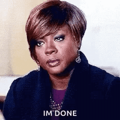 A Woman Is Sitting On A Couch And Making A Funny Face And Saying `` Im Done '' . GIF