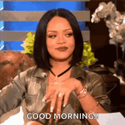 A Woman Is Sitting On A Couch And Saying `` Good Morning '' While Wearing A Choker . GIF