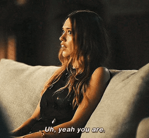 A Woman Is Sitting On A Couch And Saying `` Uh , Yeah You Are . '' GIF