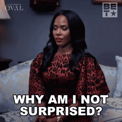 A Woman Is Sitting On A Couch And Saying Why Am I Not Surprised GIF