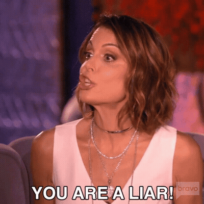 A Woman Is Sitting On A Couch And Saying You Are A Liar Bravo GIF