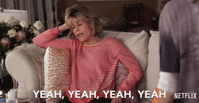 A Woman Is Sitting On A Couch And Says Yeah Yeah Yeah GIF
