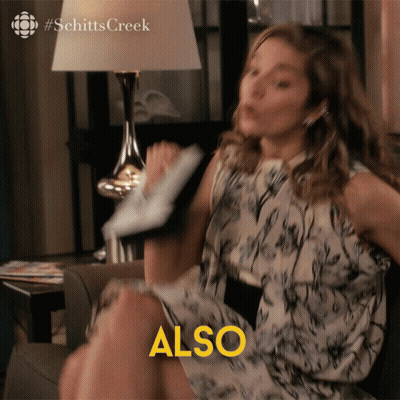 A Woman Is Sitting On A Couch And The Word Also Is Above Her GIF