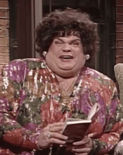 A Woman Is Sitting On A Couch Holding A Book And Making A Funny Face . GIF