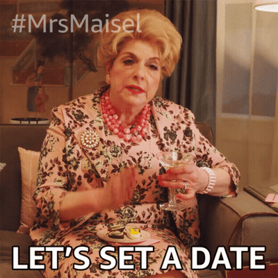 A Woman Is Sitting On A Couch Holding A Glass Of Wine And Saying " Let 'S Set A Date " .. GIF