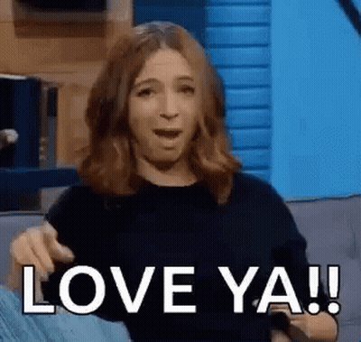 A Woman Is Sitting On A Couch Making A Funny Face And Saying `` Love Ya ! '' GIF