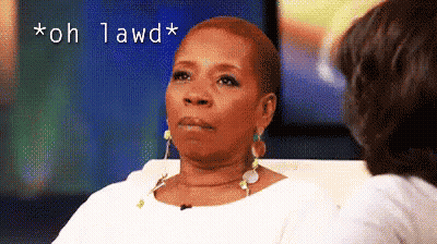 A Woman Is Sitting On A Couch Talking To Another Woman And The Words " Oh Lawd " Are Above Her GIF