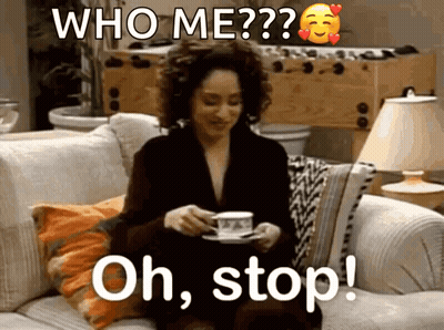 A Woman Is Sitting On A Couch With A Cup Of Coffee And A Caption That Says " Oh Stop " GIF