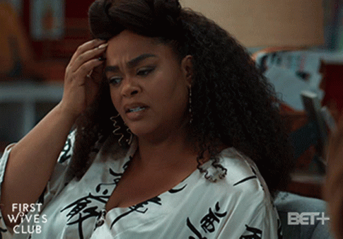 A Woman Is Sitting On A Couch With Her Hand On Her Head And The Words First Wives Club On The Bottom GIF