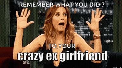 A Woman Is Sitting On A Couch With Her Hands In The Air And A Meme . GIF