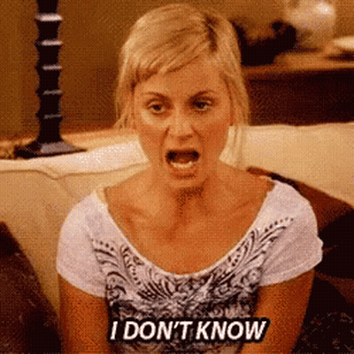 A Woman Is Sitting On A Couch With Her Mouth Open And Says I Don 'T Know GIF
