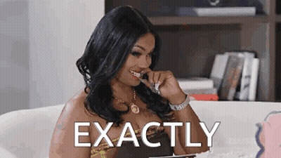 A Woman Is Sitting On A Couch With The Word Exactly Above Her Head . GIF