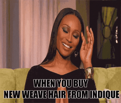 A Woman Is Sitting On A Green Couch With A Caption That Says When You Buy New Weave Hair From Indicque GIF