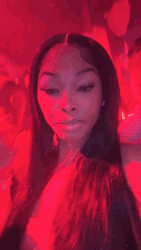 A Woman Is Sitting On A Man 'S Shoulder At A Party And Making A Funny Face . GIF