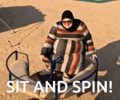 A Woman Is Sitting On A Merry Go Round With The Words Sit And Spin Written Below Her GIF