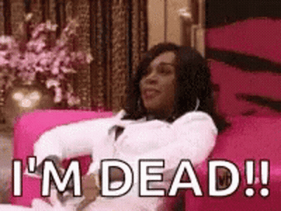 A Woman Is Sitting On A Pink Couch With The Words `` I 'M Dead '' Written On It . GIF