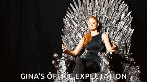 A Woman Is Sitting On A Throne Holding A Sword And A Cell Phone . GIF