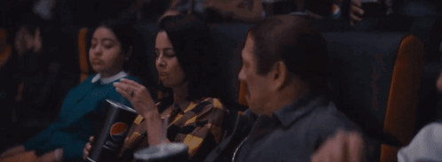 A Woman Is Sitting On A Throne Of Lies While Another Woman Looks On GIF