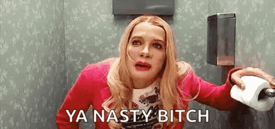 A Woman Is Sitting On A Toilet Holding A Roll Of Toilet Paper And Saying `` Ya Nasty Bitch '' . GIF