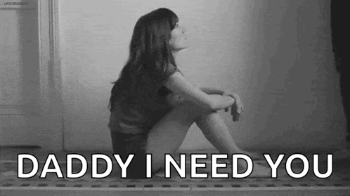 A Woman Is Sitting On The Floor With The Words `` Daddy I Need You '' . GIF