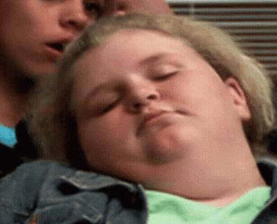 A Woman Is Sleeping With Her Eyes Closed While Another Woman Looks On . GIF