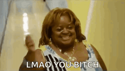 A Woman Is Smiling And Giving A Thumbs Up With The Words `` Lmao You Bitch '' Written Below Her . GIF