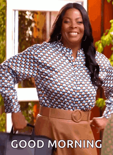 A Woman Is Smiling And Holding A Bag With The Words Good Morning Written On It GIF