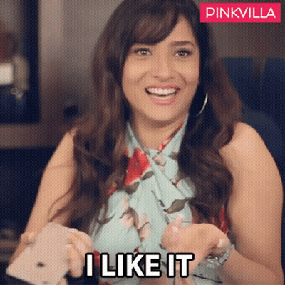 A Woman Is Smiling And Holding A Cell Phone With The Words " I Like It " On The Bottom GIF